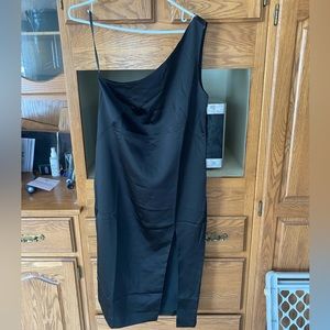 Black silk one shoulder dress.